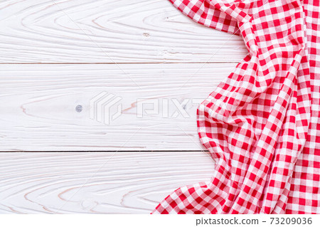 kitchen cloth (napkin) on wood background kitchen cloth (napkin) on wood background 73209036
