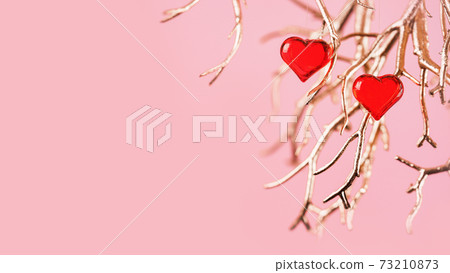 Two red glass hearts on golden branches Two red glass hearts on golden branches 73210873