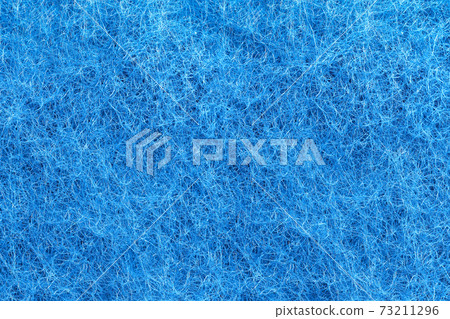 Blue felt texture. Full frame macro photography of wool fiber non-woven textile material. 73211296