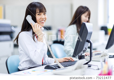 Image of a woman working in a call center Image of a woman working in a call center 73211477