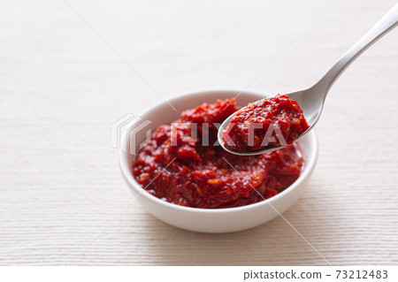 Scoop Doubanjiang with a spoon Scoop Doubanjiang with a spoon 73212483