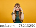 Headache grimacing pain holds the back of neck indicating location. Fatigue 73213250