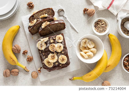 Banana bread cooking on kitchen table, top view Banana bread cooking on kitchen table, top view 73214004