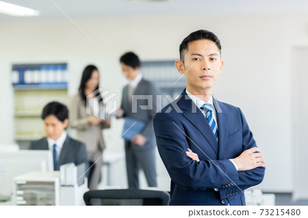 Young businessman in the office Young businessman in the office 73215480
