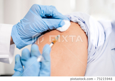 Female doctors vaccinated with syringes to prevent epidemics at hospitals, health care, and medical concepts Female doctors vaccinated with syringes to prevent epidemics at hospitals, health care, and medical concepts 73215948