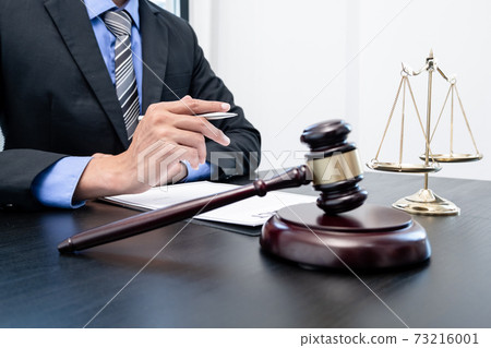 Professional male lawyers work at a law office There are scales, Scales of justice, judges gavel, and litigation documents. Concepts of law and justice Professional male lawyers work at a law office There are scales, Scales of justice, judges gavel, and litigation documents. Concepts of law and justice 73216001