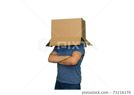 He with a cardboard box on head folded his arms on chest, isolated 73216176