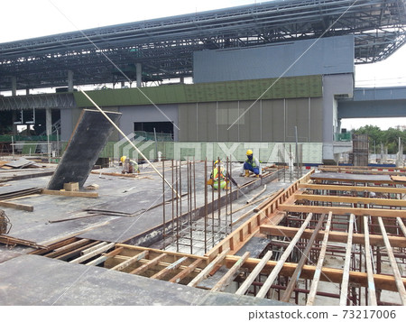 SEREMBAN, MALAYSIA -JULY 15, 2017: Construction workers fabricating timber form work mostly using timber and plywood at the construction site. SEREMBAN, MALAYSIA -JULY 15, 2017: Construction workers fabricating timber form work mostly using timber and plywood at the construction site. 73217006