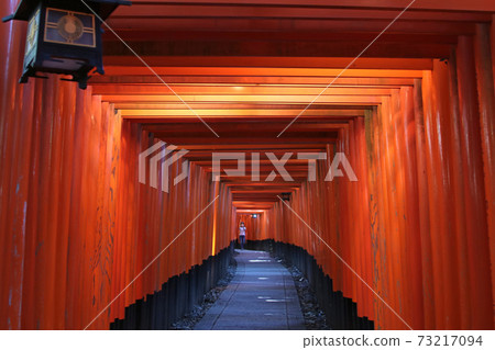 A bright red and long Fushimi Inari Taisha Senbon Torii A bright red and long Fushimi Inari Taisha Senbon Torii 73217094