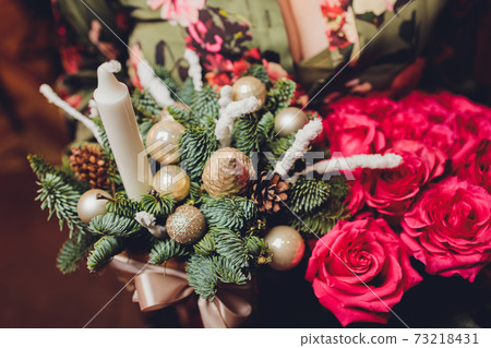 Workshop of Christmas decor with their own hands. Christmas wooden box with fir branches for the holiday. The new year celebration. Workshop of Christmas decor with their own hands. Christmas wooden box with fir branches for the holiday. The new year celebration. 73218431