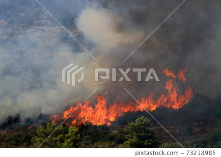 a United Nations helicopter extinguishes a fire on the Israel-Lebanon border a United Nations helicopter extinguishes a fire on the Israel-Lebanon border 73218985