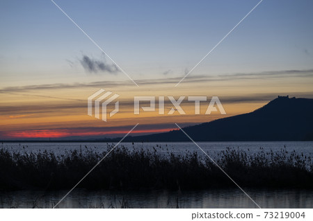 Nove Mlyny reservoir and Palava hills during sunrise in winter, Southern Moravia, Czech Republic Nove Mlyny reservoir and Palava hills during sunrise in winter, Southern Moravia, Czech Republic 73219004