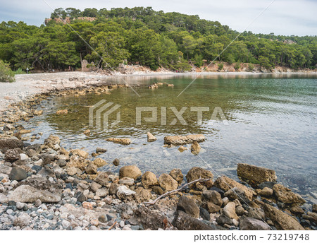 Panorama view of North Harbour of Phaselis. Ruins of Greek city on the coast of ancient Lycia. Architectural landmark near modern town Tekirova in the Kemer district of Antalya Province in Turkey. Panorama view of North Harbour of Phaselis. Ruins of Greek city on the coast of ancient Lycia. Architectural landmark near modern town Tekirova in the Kemer district of Antalya Province in Turkey. 73219748