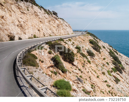 Mountain serpentine road along Mediterranean sea. Demre Finike Yolu (road). Turkey. Mountain serpentine road along Mediterranean sea. Demre Finike Yolu (road). Turkey. 73219750