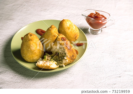 Sicilian dish arancini-fried rice balls. Italian cuisine. Copy space. Horizontal orientation 73219959