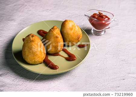 Fried rice balls stuffed with meat are a dish of Italian Sicilian cuisine. Copy space. Horizontal orientation Fried rice balls stuffed with meat are a dish of Italian Sicilian cuisine. Copy space. Horizontal orientation 73219960