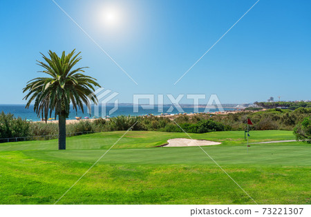 Resort luxury beaches, golf courses with palm trees, overlooking the sea for tourists to relax. Portugal algarve Resort luxury beaches, golf courses with palm trees, overlooking the sea for tourists to relax. Portugal algarve 73221307