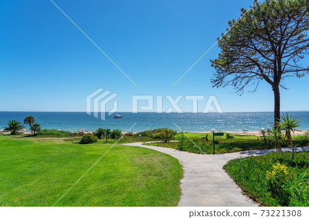 Resort luxury beaches, golf courses with palm trees, overlooking the sea for tourists to relax. Portugal algarve 73221308