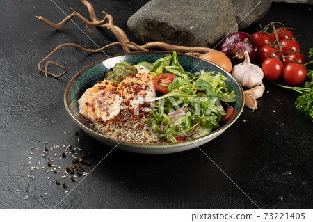 Salad with quinoa, avocado, poached egg and vegetables. Cold spicy vegetarian snack. Salad with quinoa, avocado, poached egg and vegetables. Cold spicy vegetarian snack. 73221405