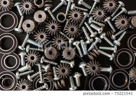 Mechanical components on black background. Industrial objects Mechanical components on black background. Industrial objects 73221541