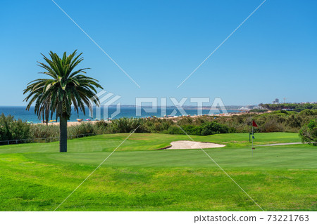 Resort luxury beaches, golf courses with palm trees, overlooking the sea for tourists to relax. Portugal algarve 73221763