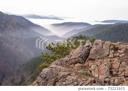 Mountain rock, hills and clouds 73221915