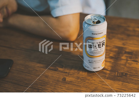 A young man who drinks canned beer and gets drunk A young man who drinks canned beer and gets drunk 73225642