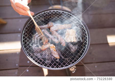 Men enjoying barbecue Men enjoying barbecue 73226380