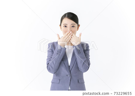 A young woman who closes her mouth, a business woman 73229655