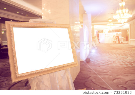 Blank Golden vintage photo frame at entrance wedding hall..Blank photo frame with copy space at hotel.Blank advertising billboard..Poster media template Ads display with copy space, Blank Golden vintage photo frame at entrance wedding hall..Blank photo frame with copy space at hotel.Blank advertising billboard..Poster media template Ads display with copy space, 73231953