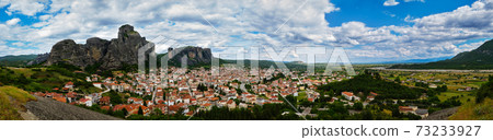 Panorama of Meteora valley and mountains at day in spring. Blue sky and great clouds, hills, Kalampaka and Kastraki. Greece, UNESCO World Heritage 73233927