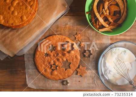 Bakery ingredients and kitchen utensils on wooden rural kitchen table for baking thematic background. Bakery ingredients and kitchen utensils on wooden rural kitchen table for baking thematic background. 73235314