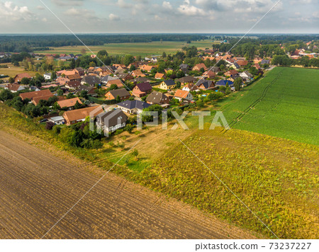 Aerial view of a small village in northern Germany  73237227
