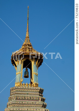 A small tower with a bell from the Temple of the Emerald Buddha. A small tower with a bell from the Temple of the Emerald Buddha. 73239610