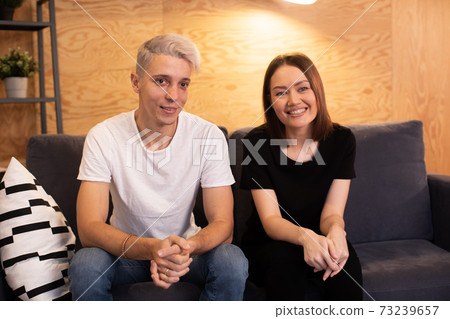 Young happy couple is sitting with a psychologist. Young couple is happy 73239657