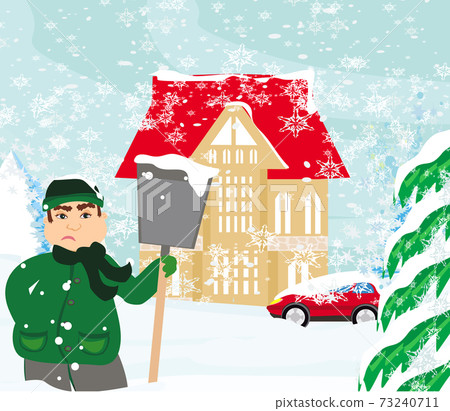 sad man is shoveling snow in front of his house 73240711