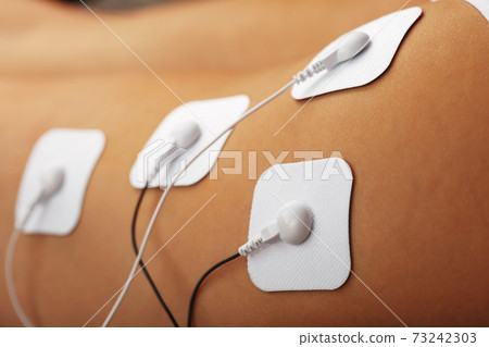 Myostimulation procedure on the legs Buttocks in a beauty salon. Myostimulation procedure on the legs Buttocks in a beauty salon. 73242303