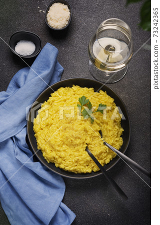 Traditional Italian risotto with saffron Traditional Italian risotto with saffron 73242365