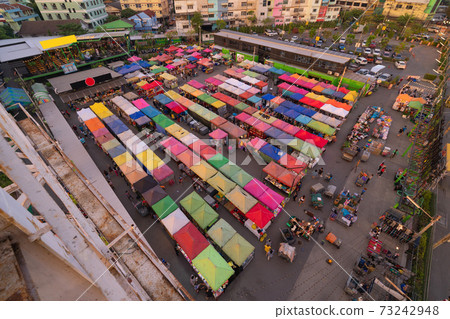 Aerial top view of Night Market people walking street, Colorful tents in the train of Ratchada at Bangkok city, Thailand. Rerail shops 73242948