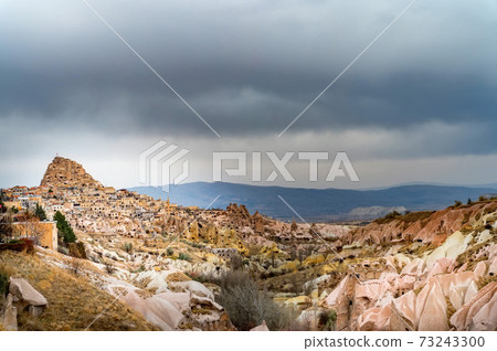Landscape view of Uchisar, Cappadocia, Turkey under cloudy sky 73243300