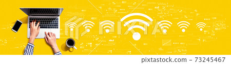 Wifi theme with person using laptop 73245467