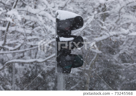 Traffic light completely covered with snow, Madrid. Traffic light completely covered with snow, Madrid. 73245568