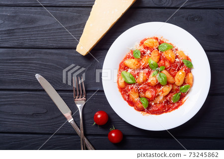 Italian homemade potatoes gnocchi with tomatoes sauce Italian homemade potatoes gnocchi with tomatoes sauce 73245862