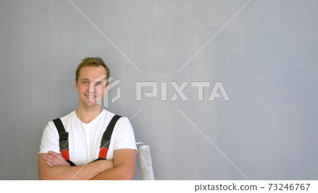 Copy space. portrait of a handsome man with a roller to paint the walls Copy space. portrait of a handsome man with a roller to paint the walls 73246767