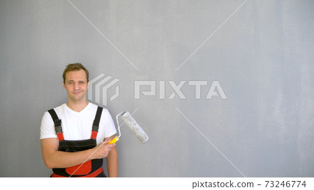 Copy space. portrait of a handsome man with a roller to paint the walls Copy space. portrait of a handsome man with a roller to paint the walls 73246774