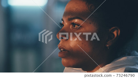 Sweaty black woman taking of hazmat suit 73246790