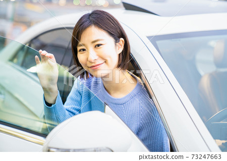 Young women in the driver's seat Young women in the driver's seat 73247663