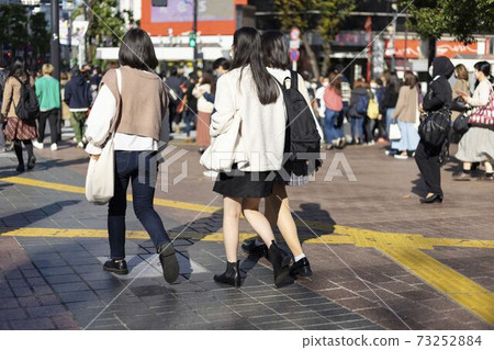 The feet of a girl walking in front of Shibuya station with platform boots The feet of a girl walking in front of Shibuya station with platform boots 73252884