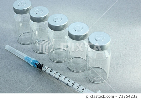 [Thumbnails of vaccination / vaccine related articles] Vaccine vials and syringes 73254232