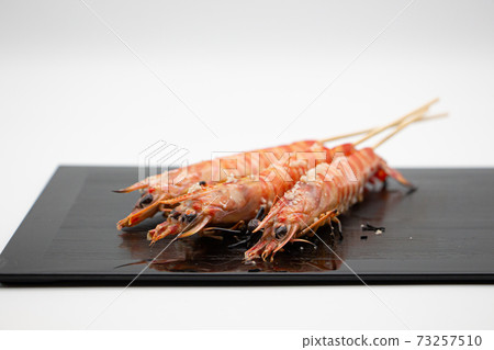 Grilled prawns from Nagasaki prefecture on a black plate Grilled prawns from Nagasaki prefecture on a black plate 73257510